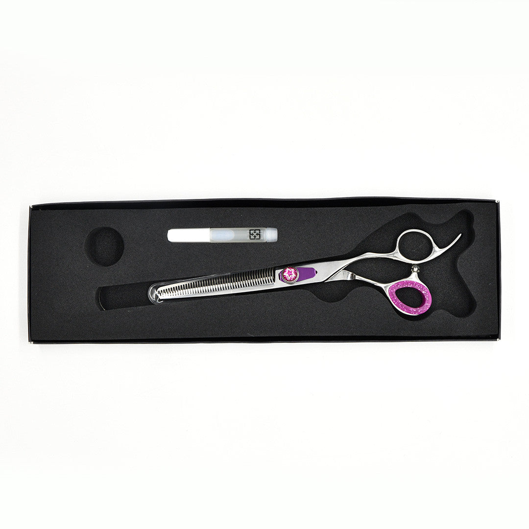 Monk Purple 7" 46-Tooth Thinning Shear in a protective black foam-lined case with gel finger ring and shear oil