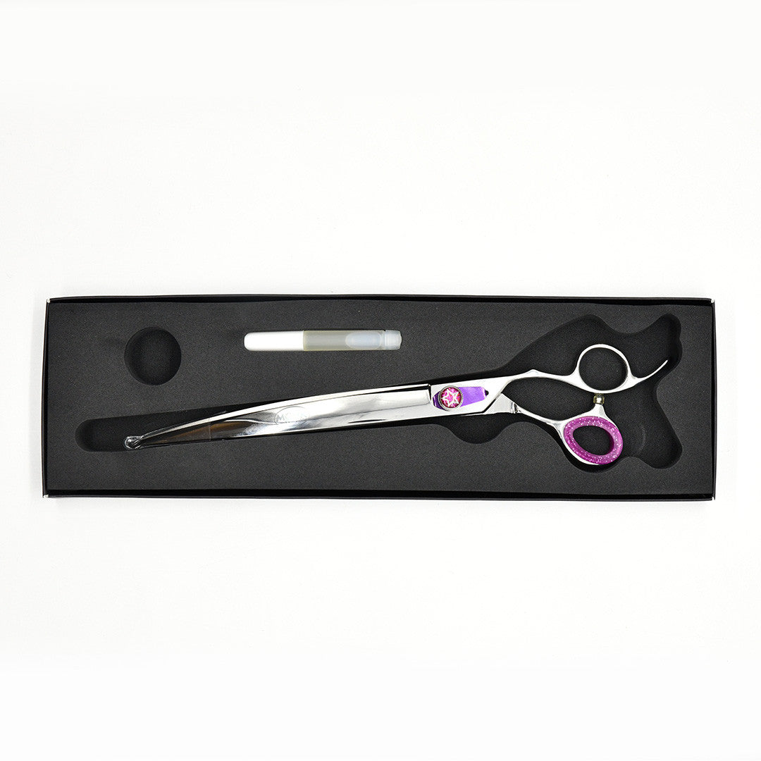 Monk Purple 9.5" Curved Shear in a protective black foam-lined case with gel finger ring and shear oil