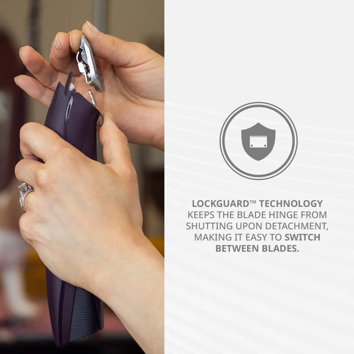 Close-up of hands removing a blade from the Wahl KM Supera, highlighting LOCKGUARD technology that prevents the blade hinge from shutting, making it easy to switch between blades