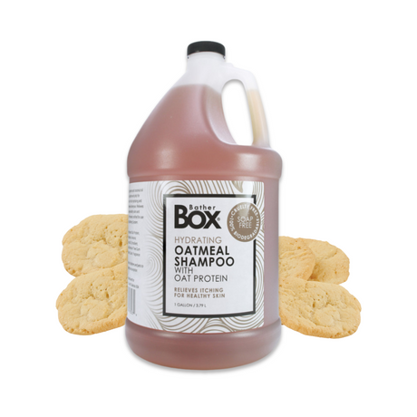 Gallon jug of BatherBox® Oatmeal Shampoo displayed with sugar cookies in the background