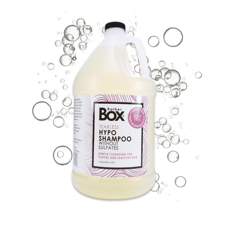Gallon jug of BatherBox® Hypo Shampoo surrounded by soft soap bubbles