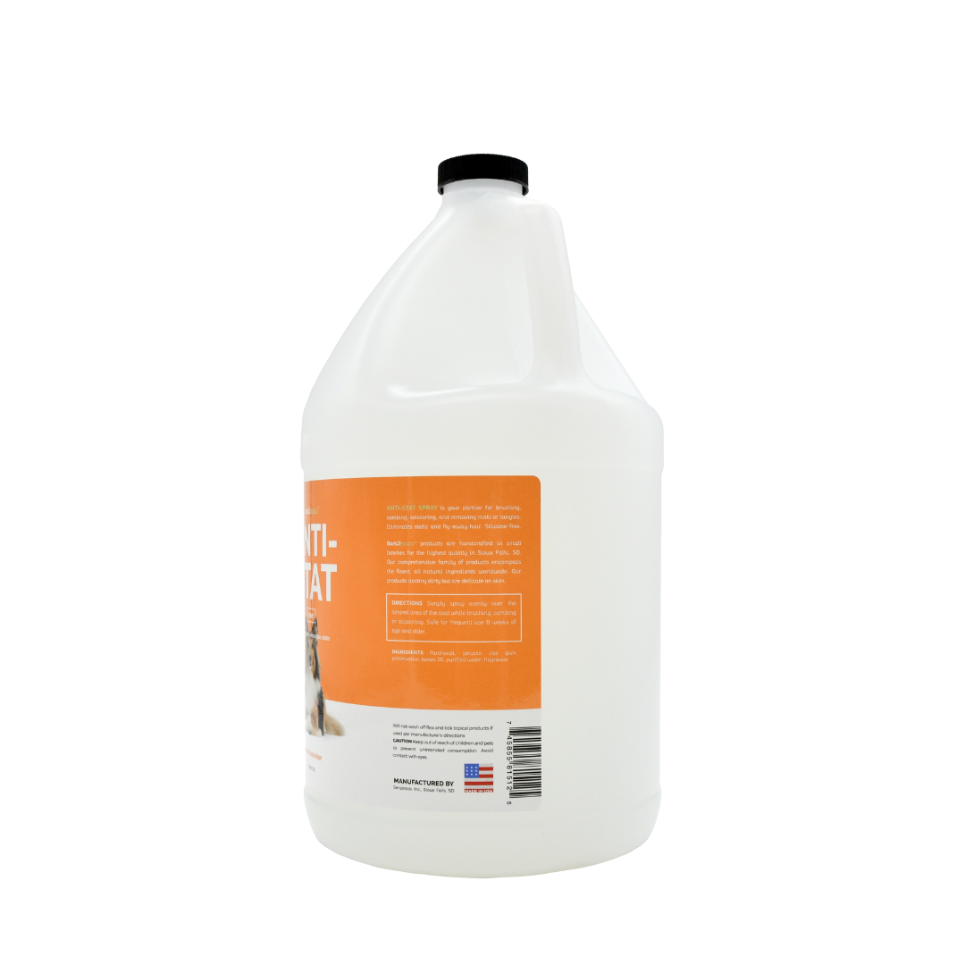 Side view of Bark2Basics Anti-Stat Spray gallon jug, showcasing product label with ingredients and description