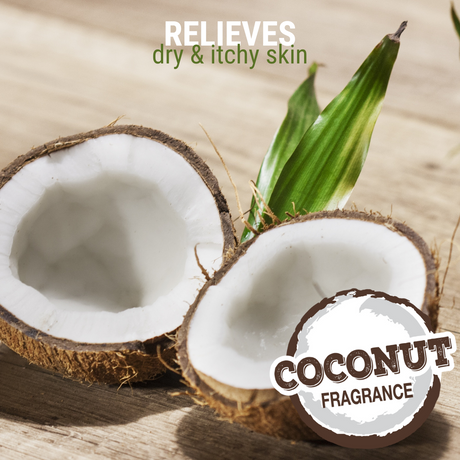 Close-up of freshly halved coconuts on a wooden table accompanied by the text: 'relieves dry and itchy skin, coconut fragrance'