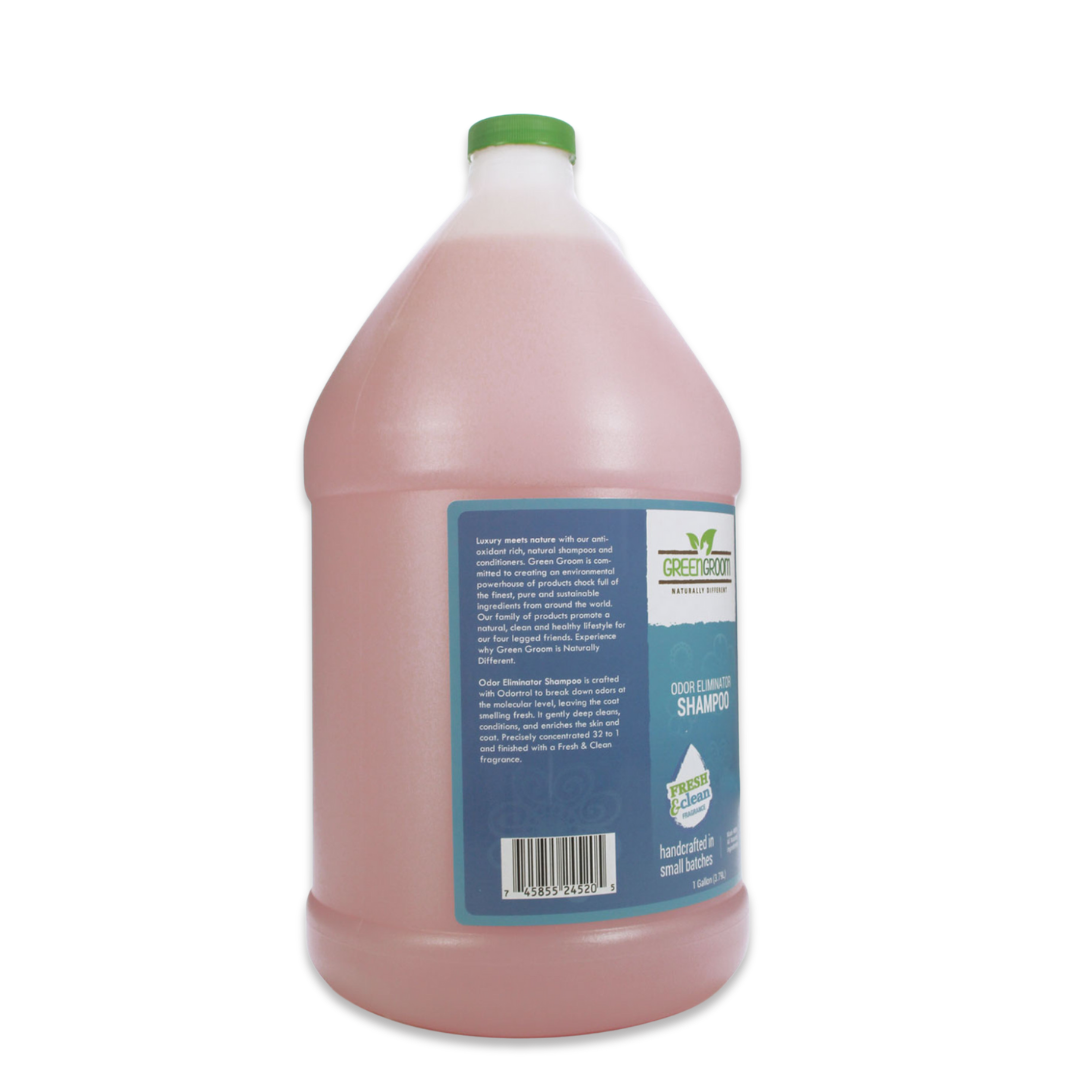Left side view of Green Groom Odor Eliminator Shampoo gallon jug, showcasing product description