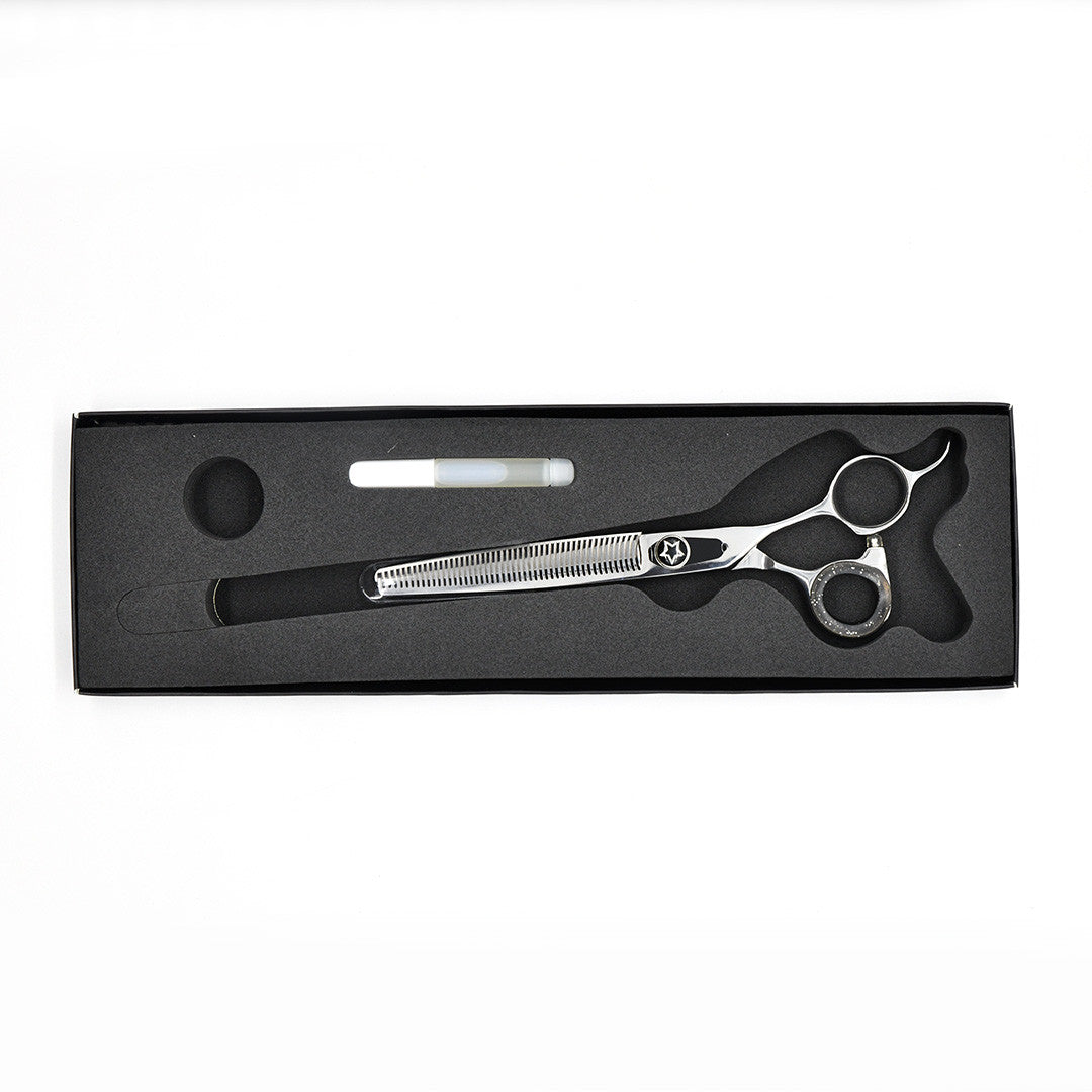 Monk Black 7" 48-Tooth Thinning Shear in a protective black foam-lined case with gel finger ring and shear oil