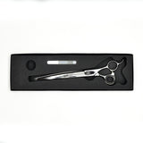 Monk Black 8.5" Curved Shear in a protective black foam-lined case with gel finger ring and shear oil