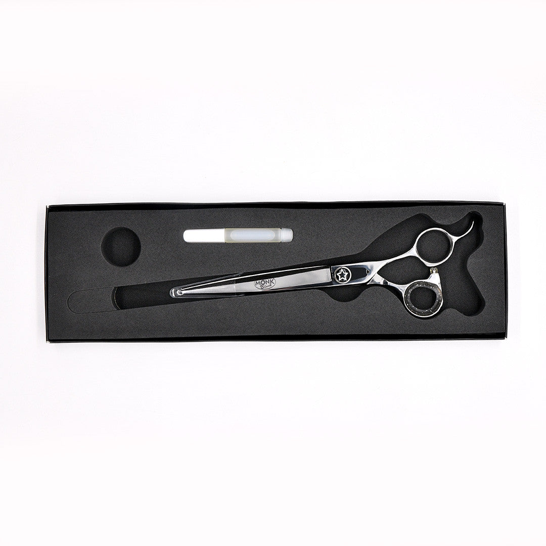 Monk Black 7.5" Straight Shear in a protective black foam-lined case with gel finger ring and shear oil