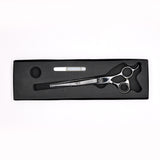 Monk Black 7.5" Straight Shear in a protective black foam-lined case with gel finger ring and shear oil