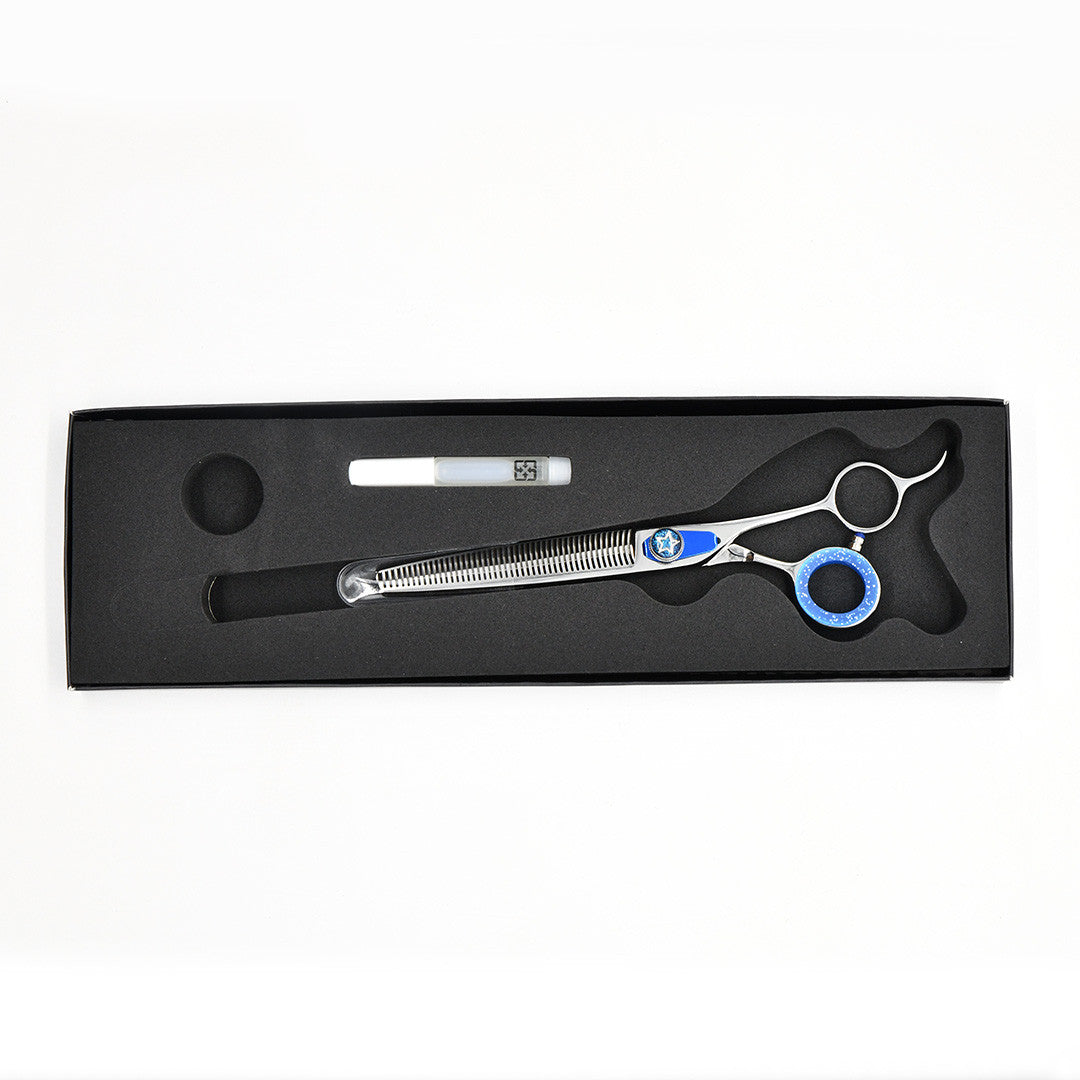Monk Blue 7.5" 46-Tooth Thinning Shear in a protective black foam-lined case with gel finger ring and shear oil