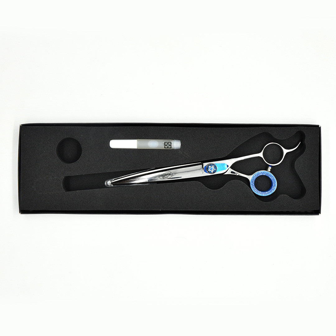 Monk Blue 7.5" Curved Shear in a protective black foam-lined case with gel finger ring and shear oil