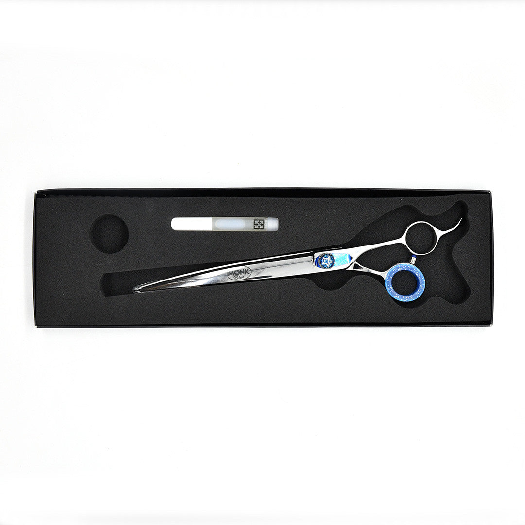 Monk Blue 8.5" Curved Shear in a protective black foam-lined case with gel finger ring and shear oil