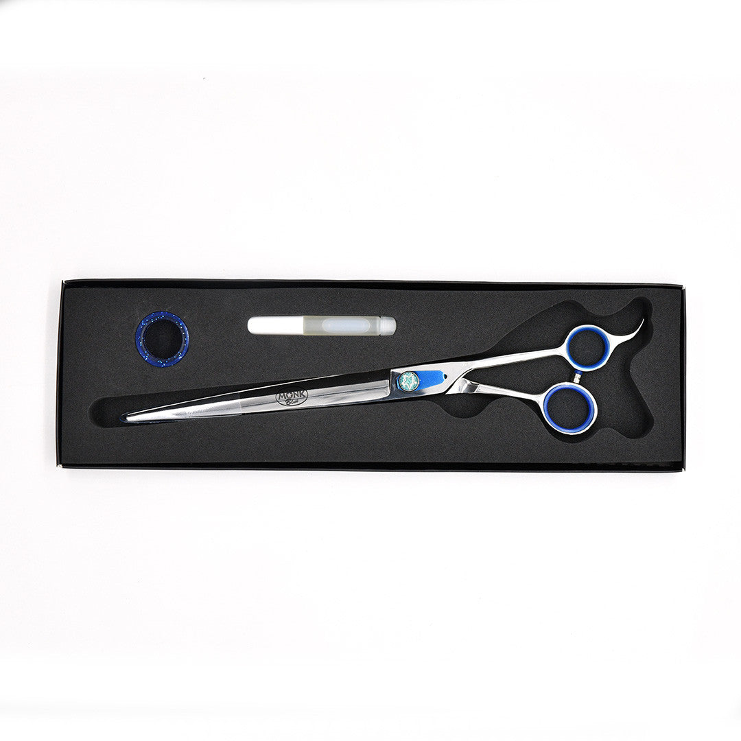 Monk Blue 10" Straight Shear in a protective black foam-lined case with gel finger ring and shear oil