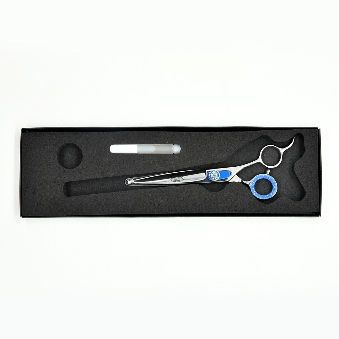 Monk Blue 6.5" Straight Shear in a protective black foam-lined case with gel finger ring and shear oil