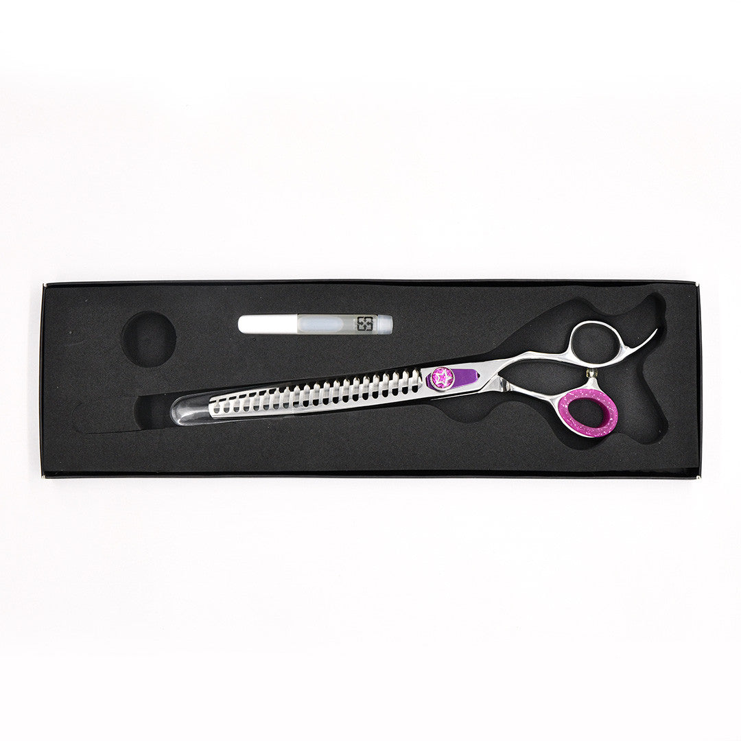 Monk Purple 8.25" 21-Tooth Blending Shear in a protective black foam-lined case with gel finger ring and shear oil
