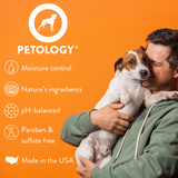 Smiling man holding a Jack Russell Terrier, alongside the Petology logo and key product features: moisture control, nature's ingredients, pH-balanced, paraben and sulfate free and made in the USA