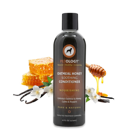 16 oz bottle of Petology Oatmeal Honey Soothing Conditioner, displayed with honeycomb, dripping honey, vanilla pods and white vanilla orchid flowers