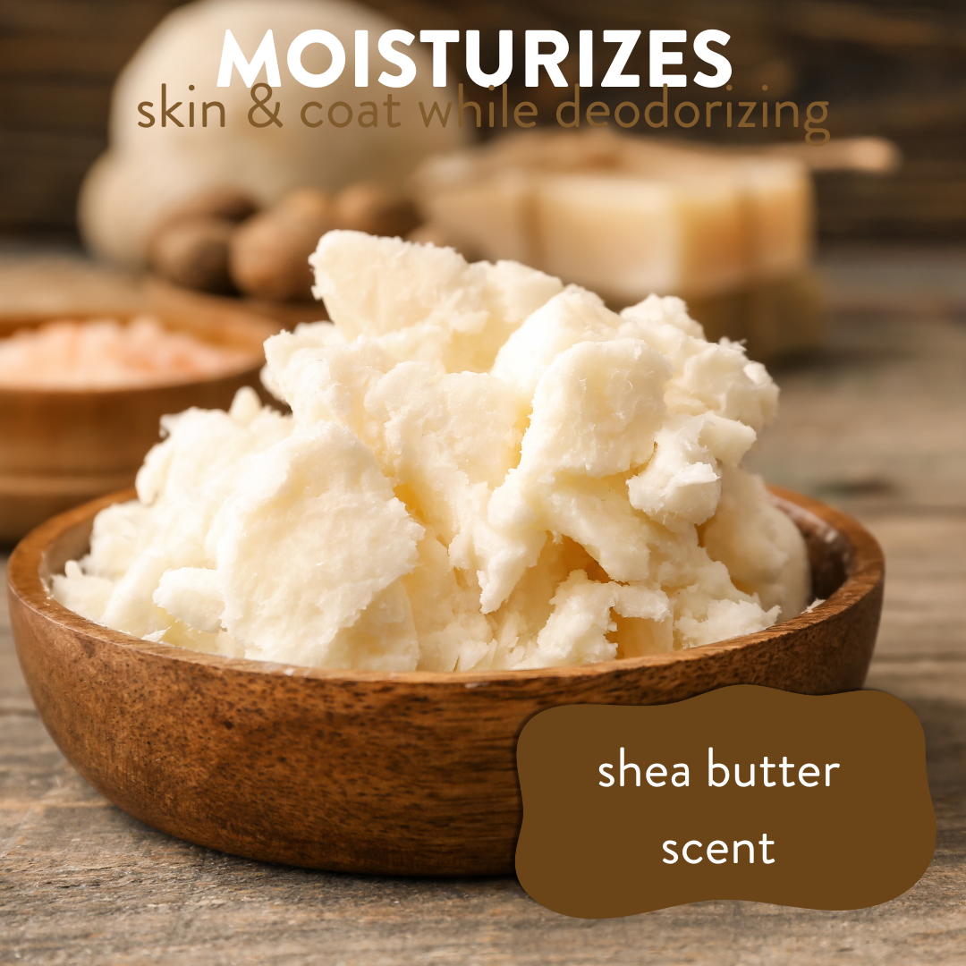 Creamy shea butter in a wooden bowl on a table, accompanied by the text: 'moisturizes skin and coat while deodorizing, shea butter scent'