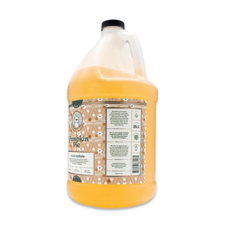 Side view of Seasonal Scents Pumpkin Pie Shampoo gallon jug, showcasing product label with ingredients and description