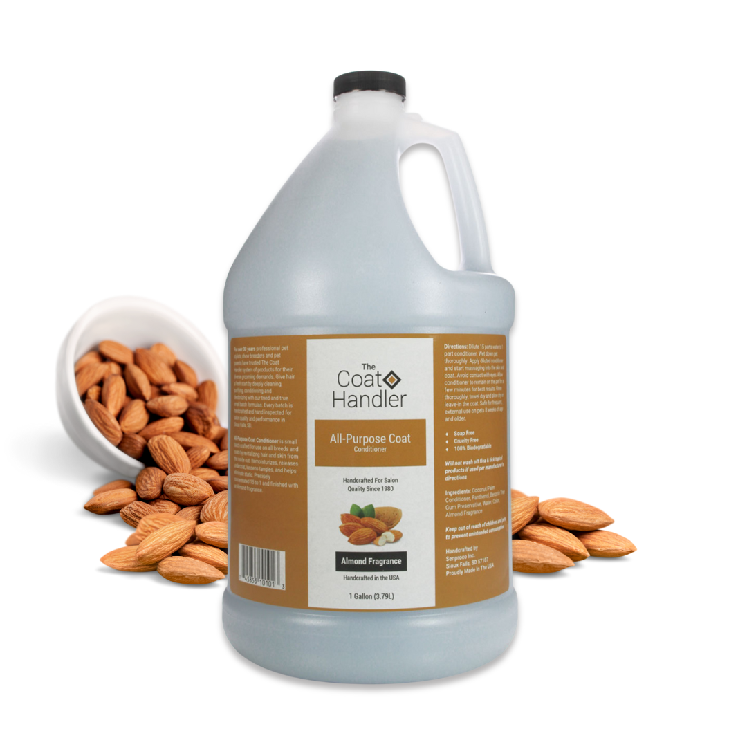 Gallon jug of The Coat Handler All-Purpose Coat Conditioner displayed with whole almonds spilling from a white bowl