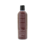 Back view of The Coat Handler Clarifying Shampoo 16 oz bottle, showcasing product label with ingredients and description