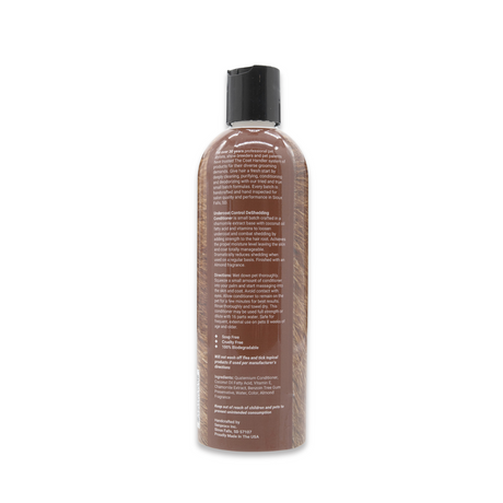 Back view of The Coat Handler Undercoat Control DeShedding Conditioner 16 oz bottle, showcasing product label with ingredients and description