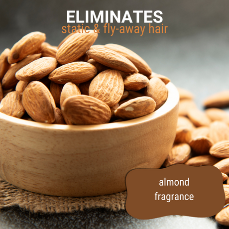Close-up of almonds in a wooden bowl accompanied by the text: 'eliminates static and fly-away hair, almond fragrance'
