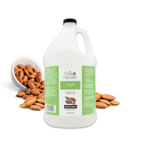 Gallon jug of The Coat Handler Detangler Spray displayed with whole almonds spilling from a white bowl